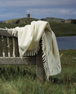 Vaila organic wool blanket on a bench